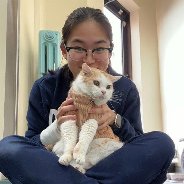 Lizzy, Vet Assistant holding cat